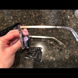 DIFF eyewear. Pink lenses with clear frames.